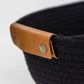Woven storage basket with leather handles