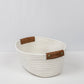 Woven storage basket with leather handles