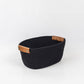 Woven storage basket with leather handles